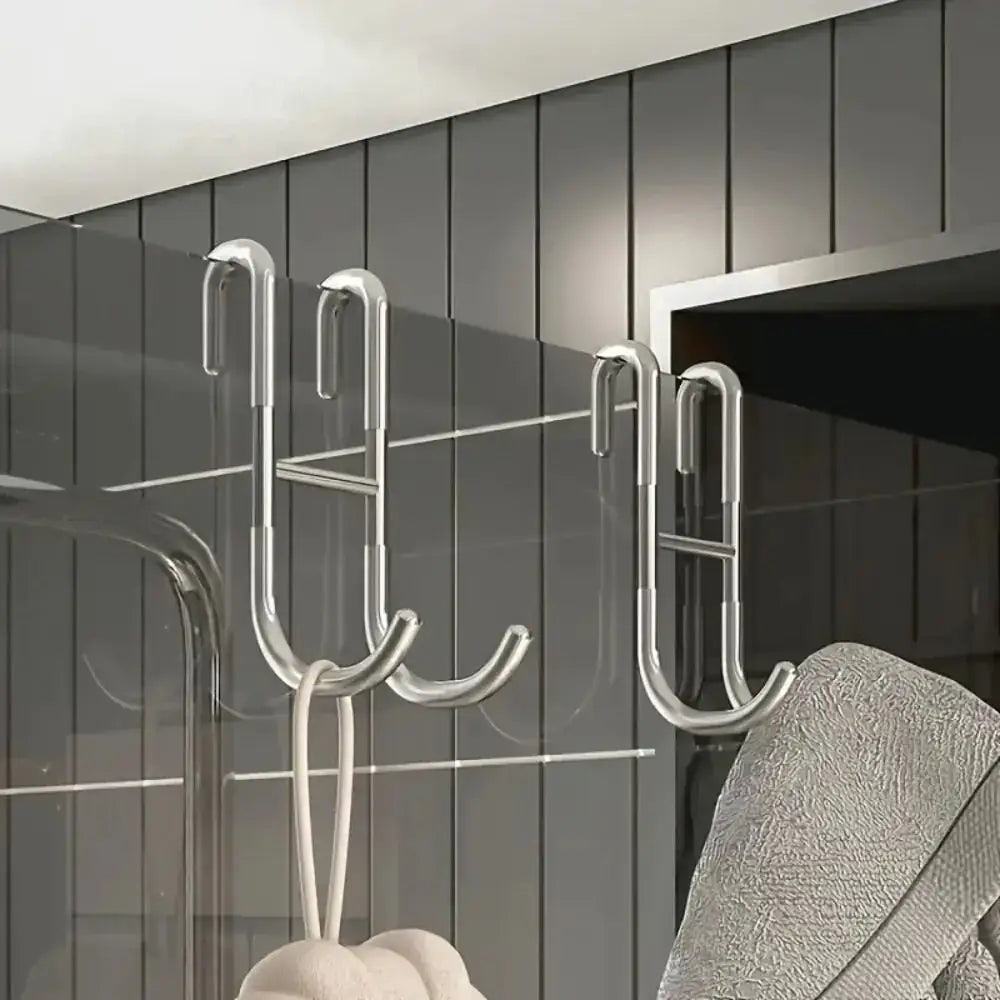 Rust Resistant Multifunctional Shower Door Hook hanging over a glass shower door, ideal for towels and accessories.