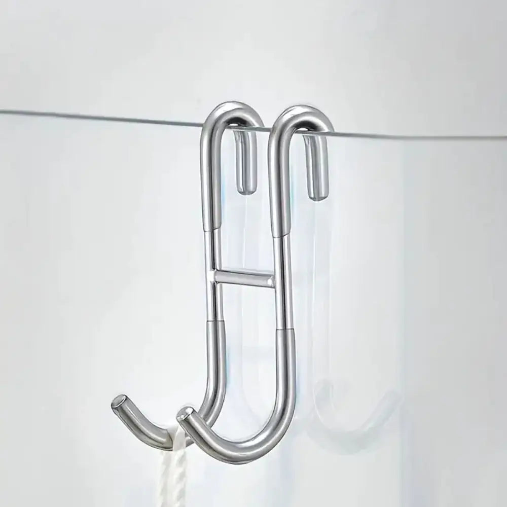 Rust Resistant Multifunctional Shower Door Hook displayed on a sleek bathroom wall, ideal for towels and loofahs.